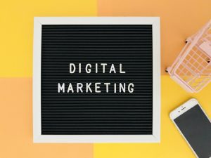 Digital marketing board on yellow and coral background
